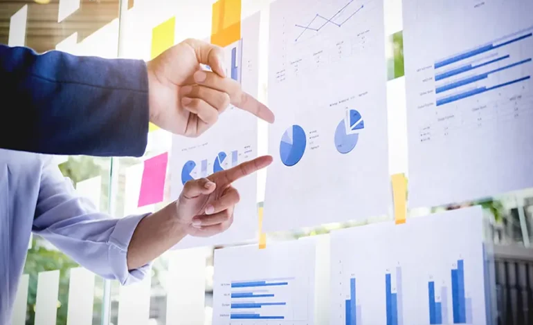 Business professionals reviewing market research reports and business intelligence data.