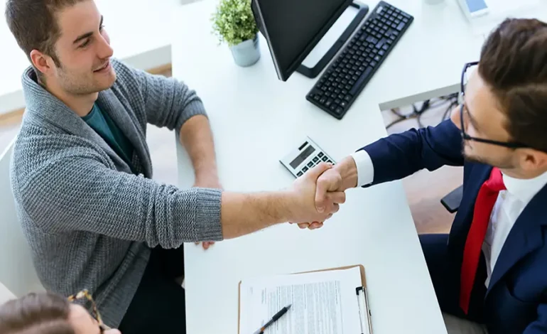 Business executives shaking hands during a partnership discussion.